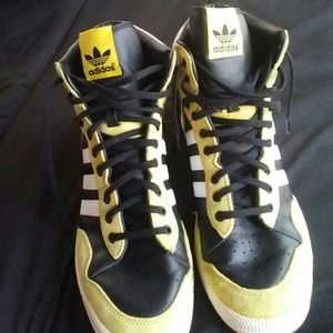 Yellow black and white adidas sneakers